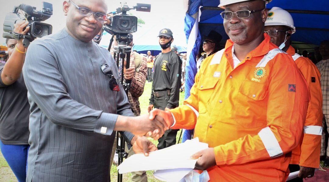 Convener and leader of the Ogoni Liberation Initiative, Rev. Douglas Fabeke (left), presenting a communique from the Ogoni leaders to the Managing Director, Nigerian Petroleum Development Company (NPDC), Mr. Mohammed Ali-Zarah, who was invited as guest to the Ogoni Liberation Day celebration which held in Bori, Rivers State