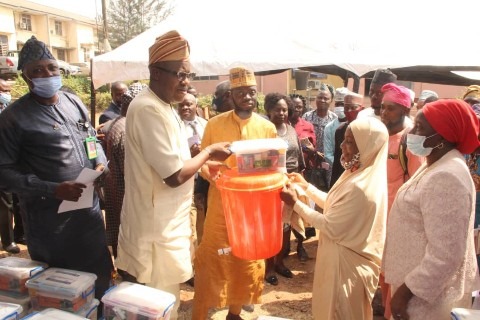 Dr Adeniran distributing COVID-19 kits as Oyo Govt. Distributes First Aid Kits to 250 BESDA Learning Centers