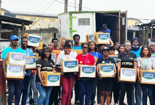 Unity Bank staff, Lagos Food Bank team and volunteers carrying the "Unity Boxes of Hope" for distribution in Ogundimu Ilaje community, Lagos.