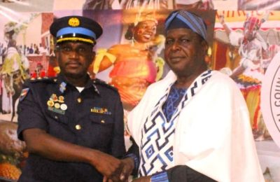 Otunba Runsewe presenting a souvenir to the head of Zambian delegation, Col.Masheke Mutemwa.
