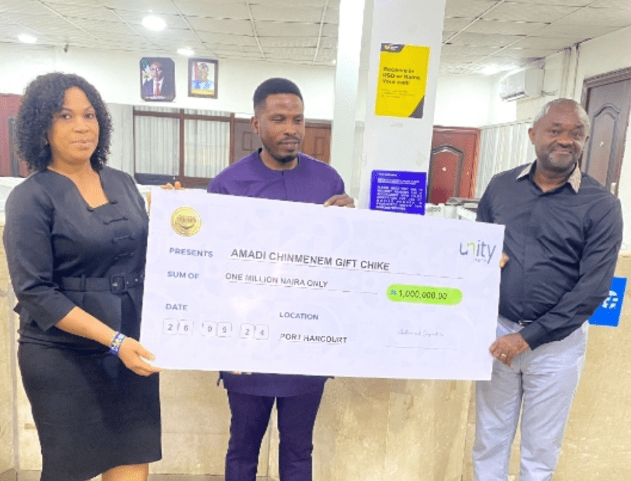 From left: Chioma Umeh, Unity Bank Branch Manager, Aba Road 1, Port Harcourt; Amadi Chinmenem Gift Chike, the grand prize winner, and Mr. Etop Ukpe, Unity Bank's Regional Manager, Port Harcourt/Uyo Region presening the N1M check to the winner, recently.