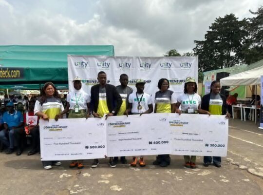 The winners of Corpreneurship Challenge pose for a photo with Unity Bank teams in Lagos