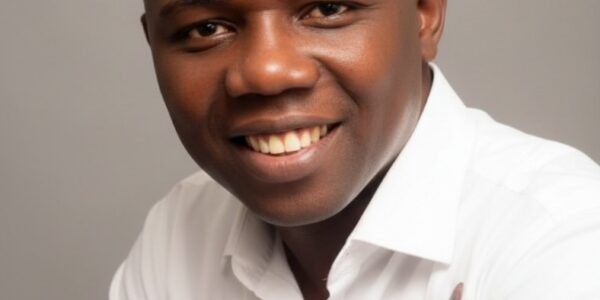 In September 2010, during his undergraduate days, the National Association of Idoma Students, FUT Minna Chapter, then led by Comrade Omaga E. Daniel, conferred on Osisiogu Osikenyi E. the title “Okp’Idoma” — literally “The People’s Leader / Defender of the Idoma”.