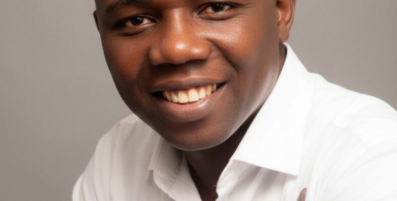 In September 2010, during his undergraduate days, the National Association of Idoma Students, FUT Minna Chapter, then led by Comrade Omaga E. Daniel, conferred on Osisiogu Osikenyi E. the title “Okp’Idoma” — literally “The People’s Leader / Defender of the Idoma”.